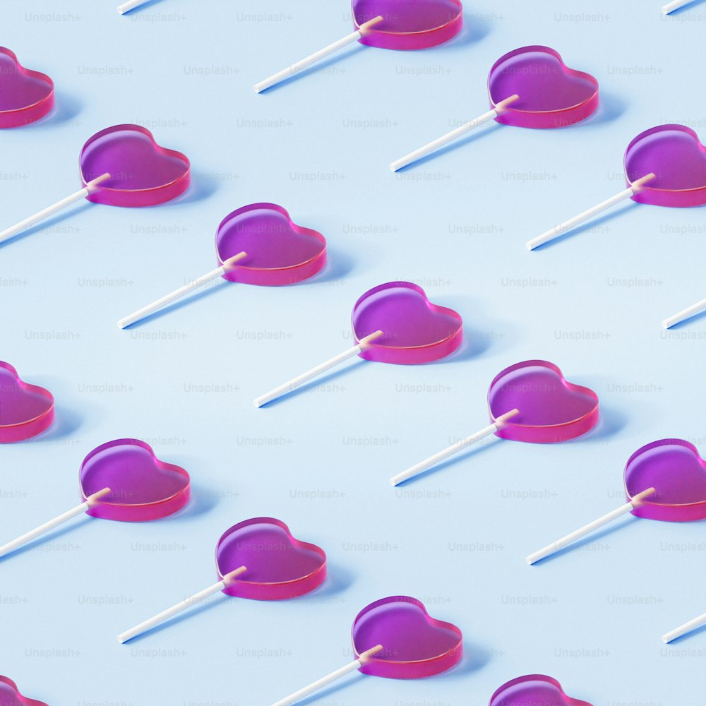 a heart shaped lollipop on a blue background
