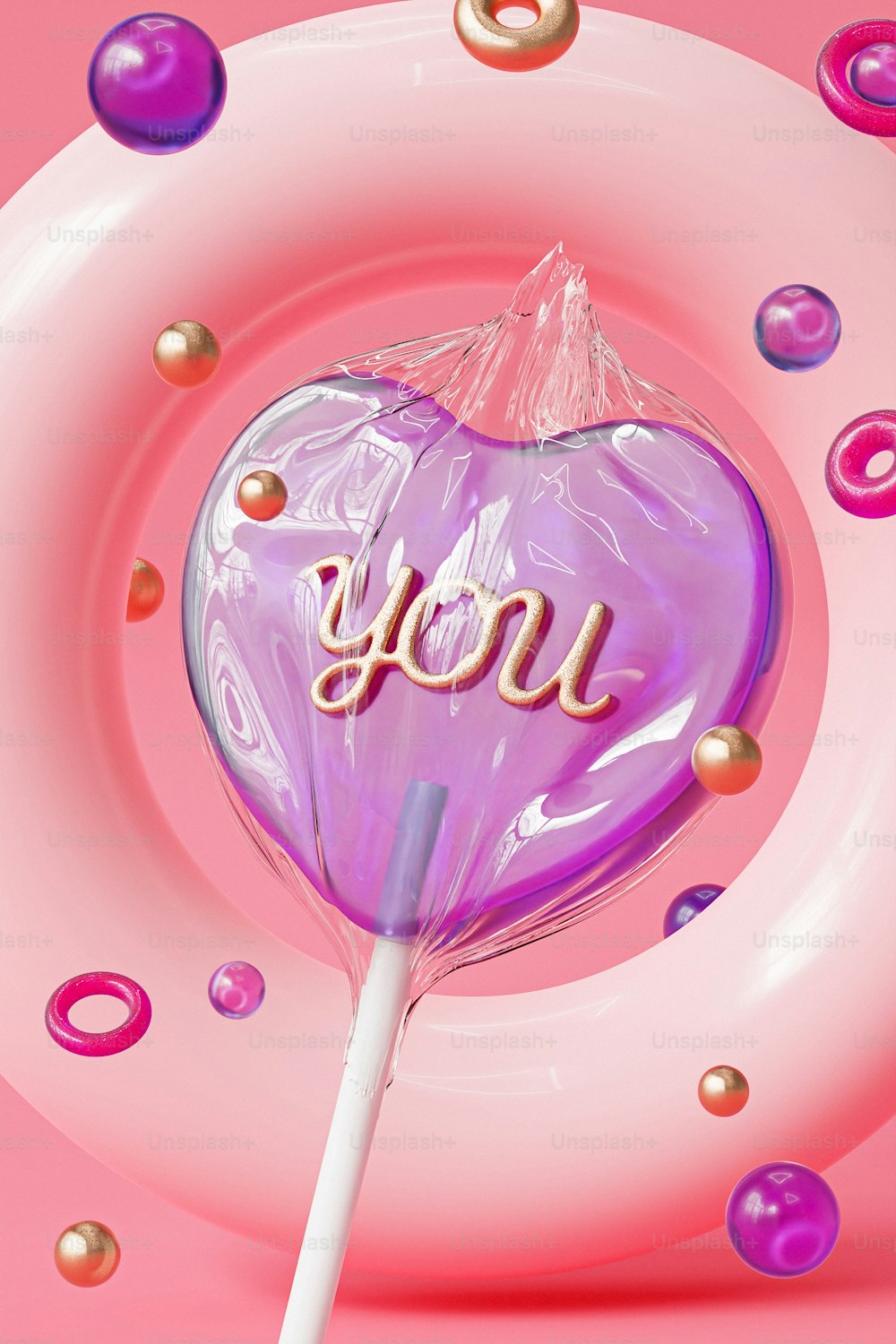 a pink lollipop with the word you on it