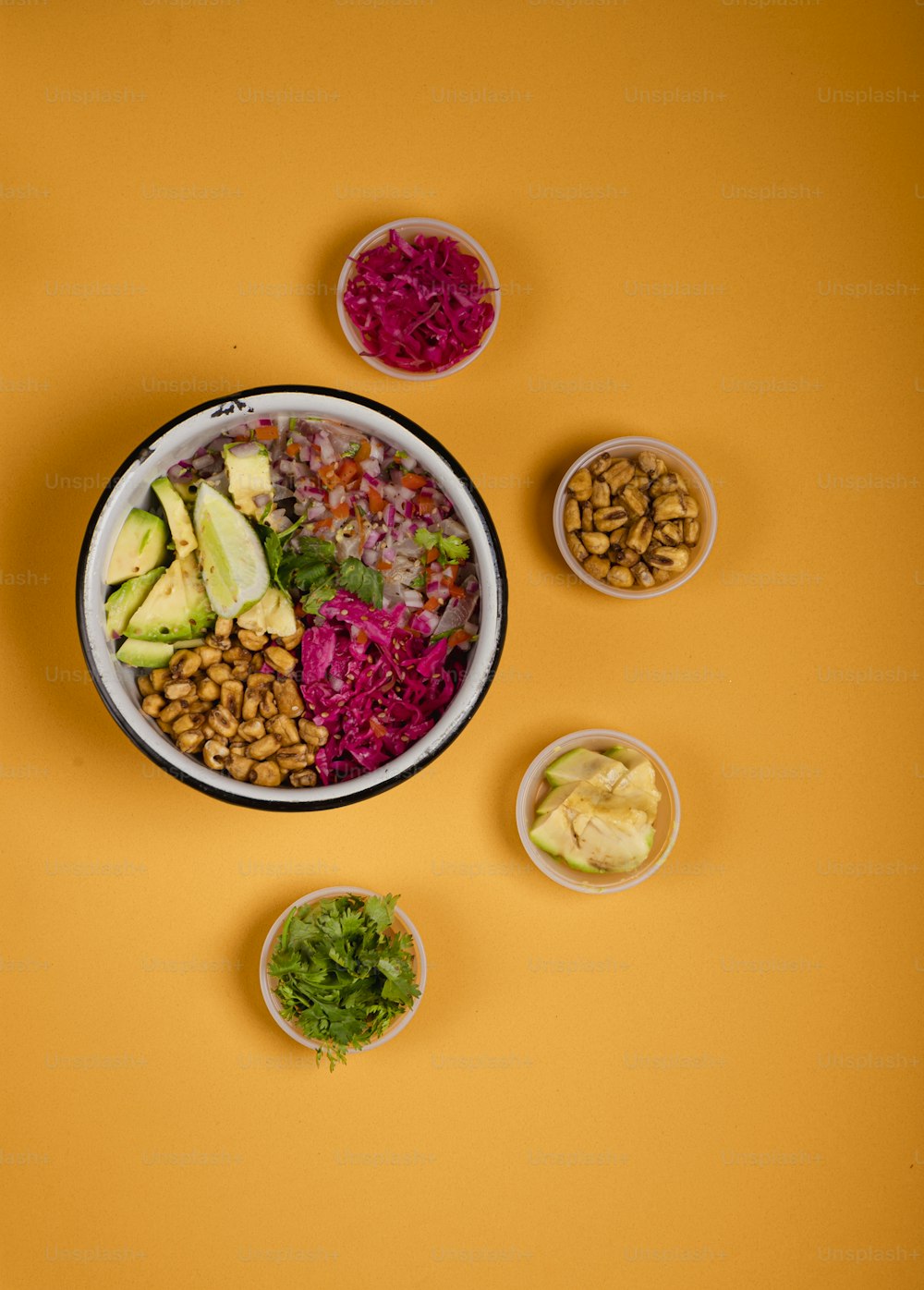 a bowl of food on a yellow background