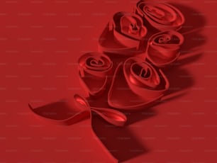 a bunch of red roses with a ribbon on a red background