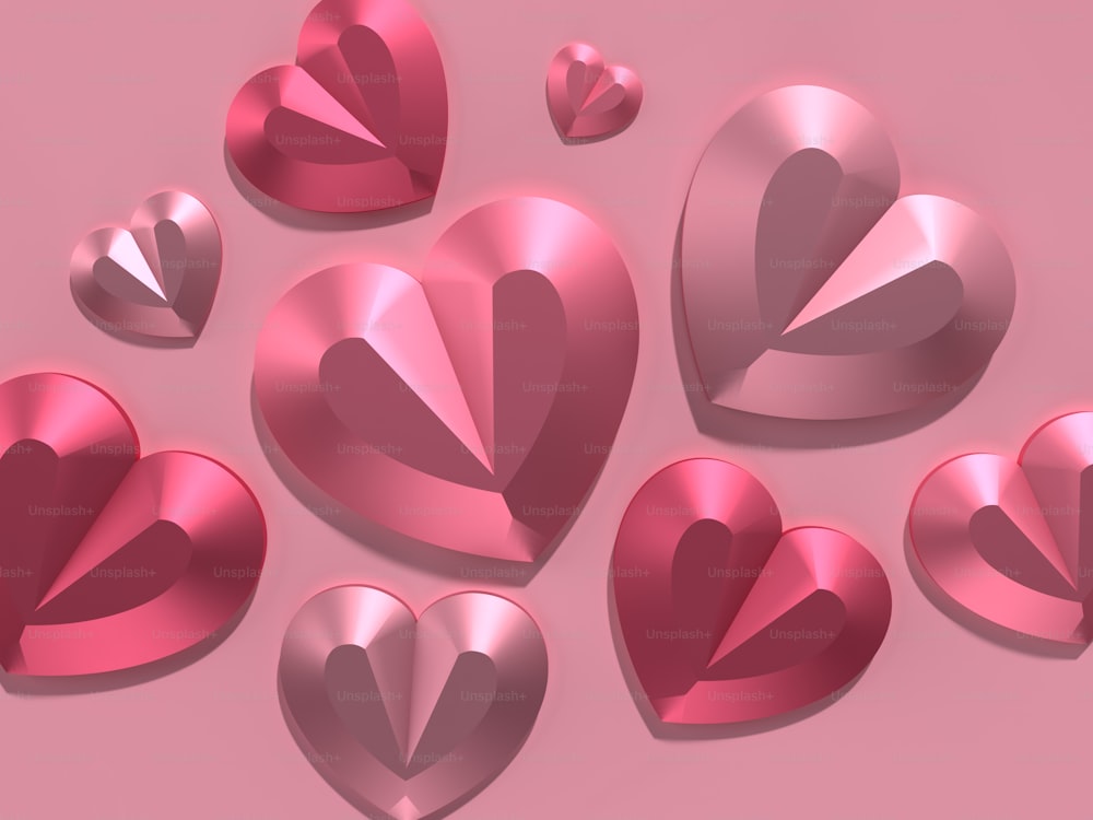 a bunch of shiny hearts on a pink background