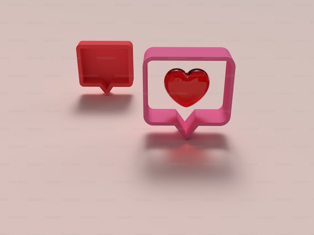 a red heart in a pink speech bubble