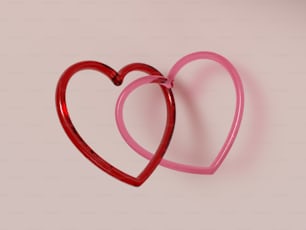 un paio di occhiali rossi a forma di cuore su uno sfondo rosa