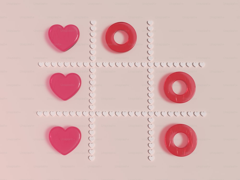 un fond rose avec quatre formes différentes de beignets
