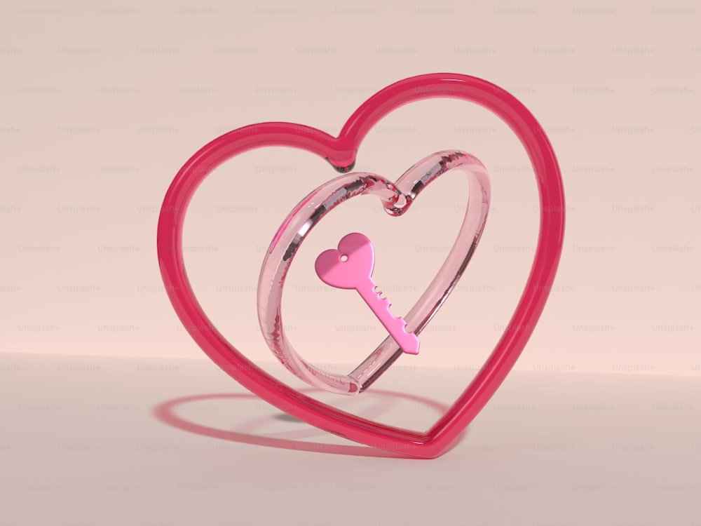 a pink heart shaped object with a key inside of it