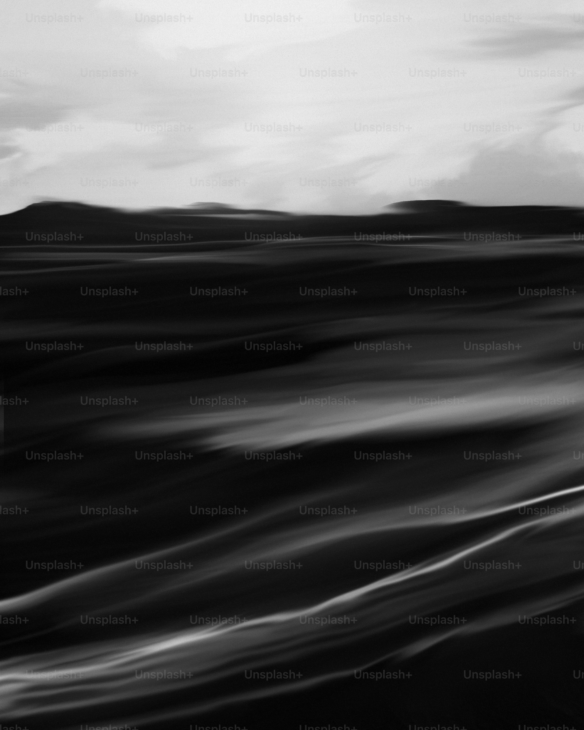 a black and white photo of the ocean