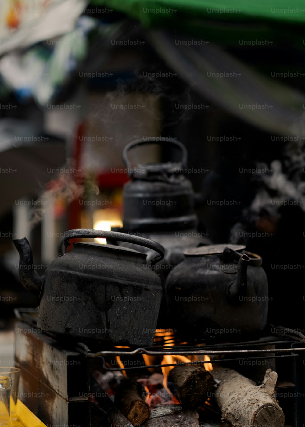 a stove with two tea kettles on top of it