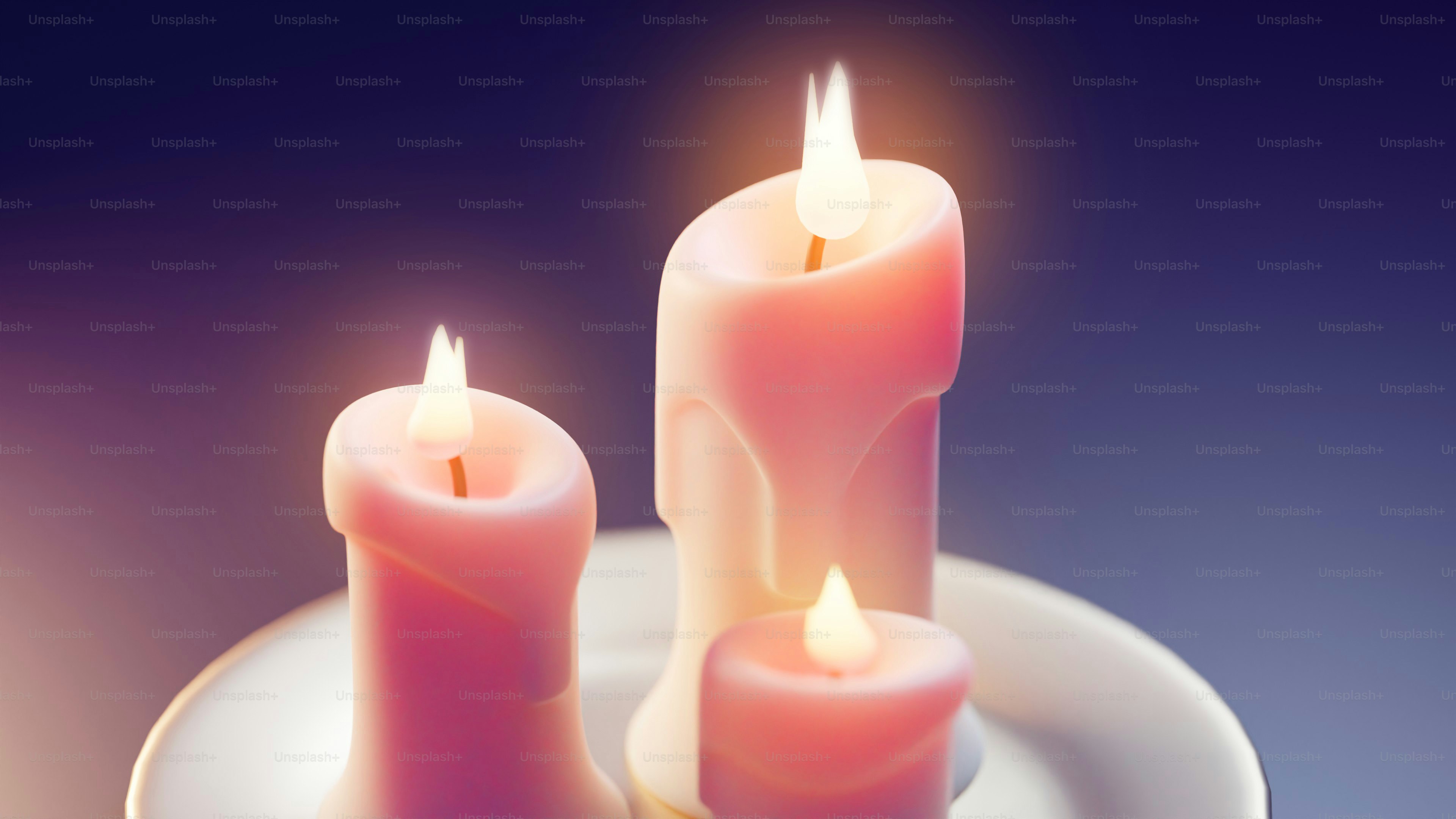 three lit candles on a plate on a table