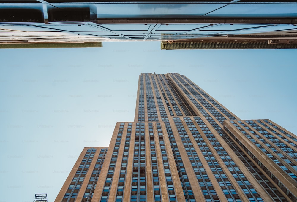 looking up at the top of a tall building