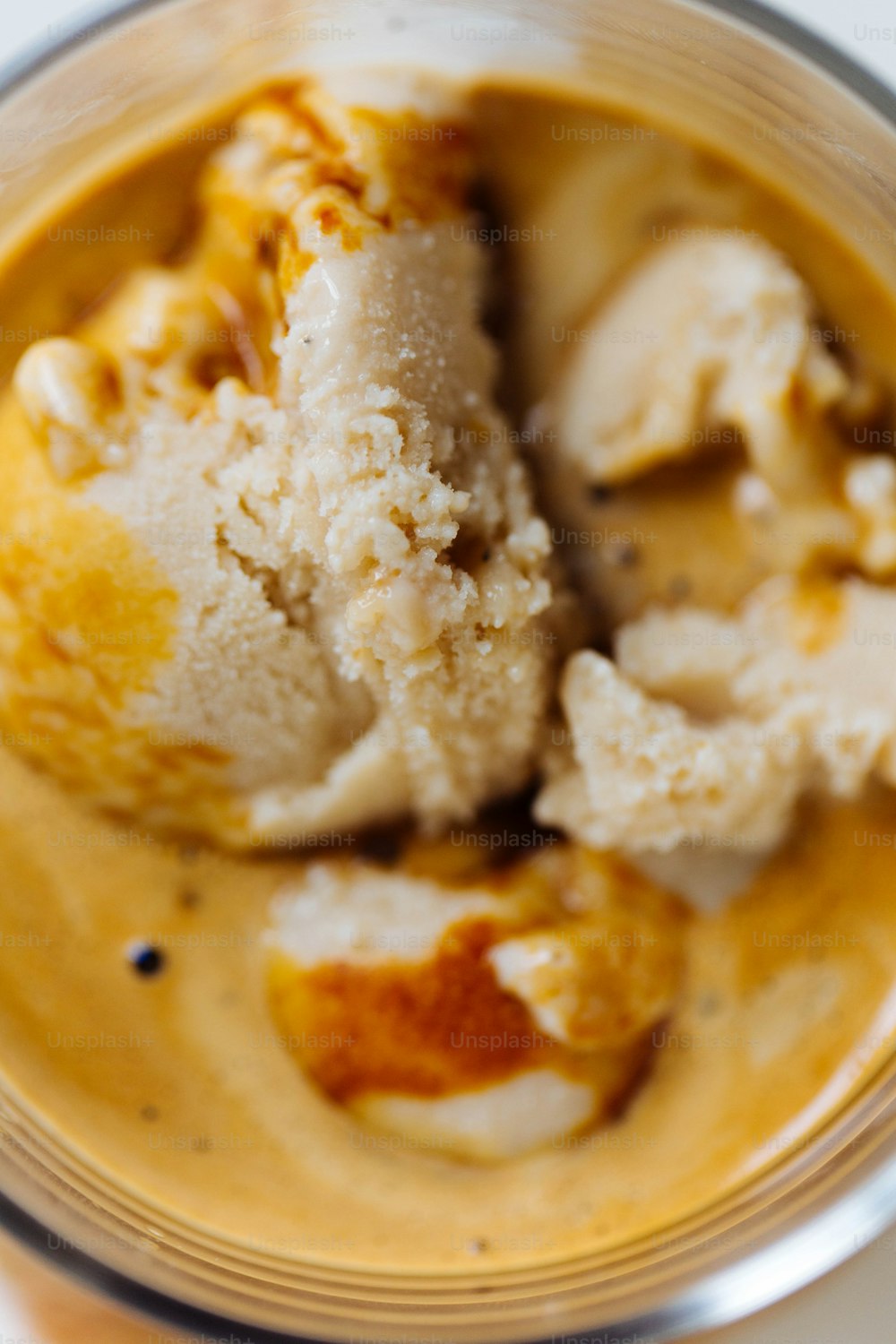 a bowl filled with ice cream on top of a table