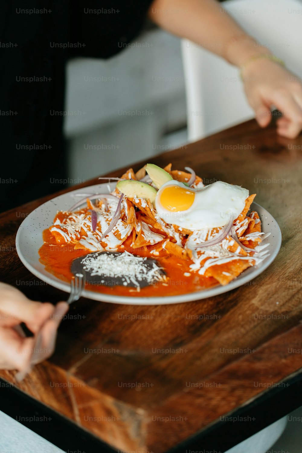 a plate of food on a wooden table