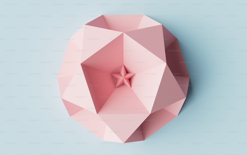 a pink object with a star on top of it