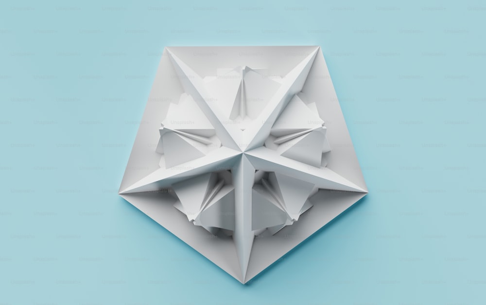 a white origami object on a blue background