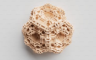 an intricate wooden object on a white surface