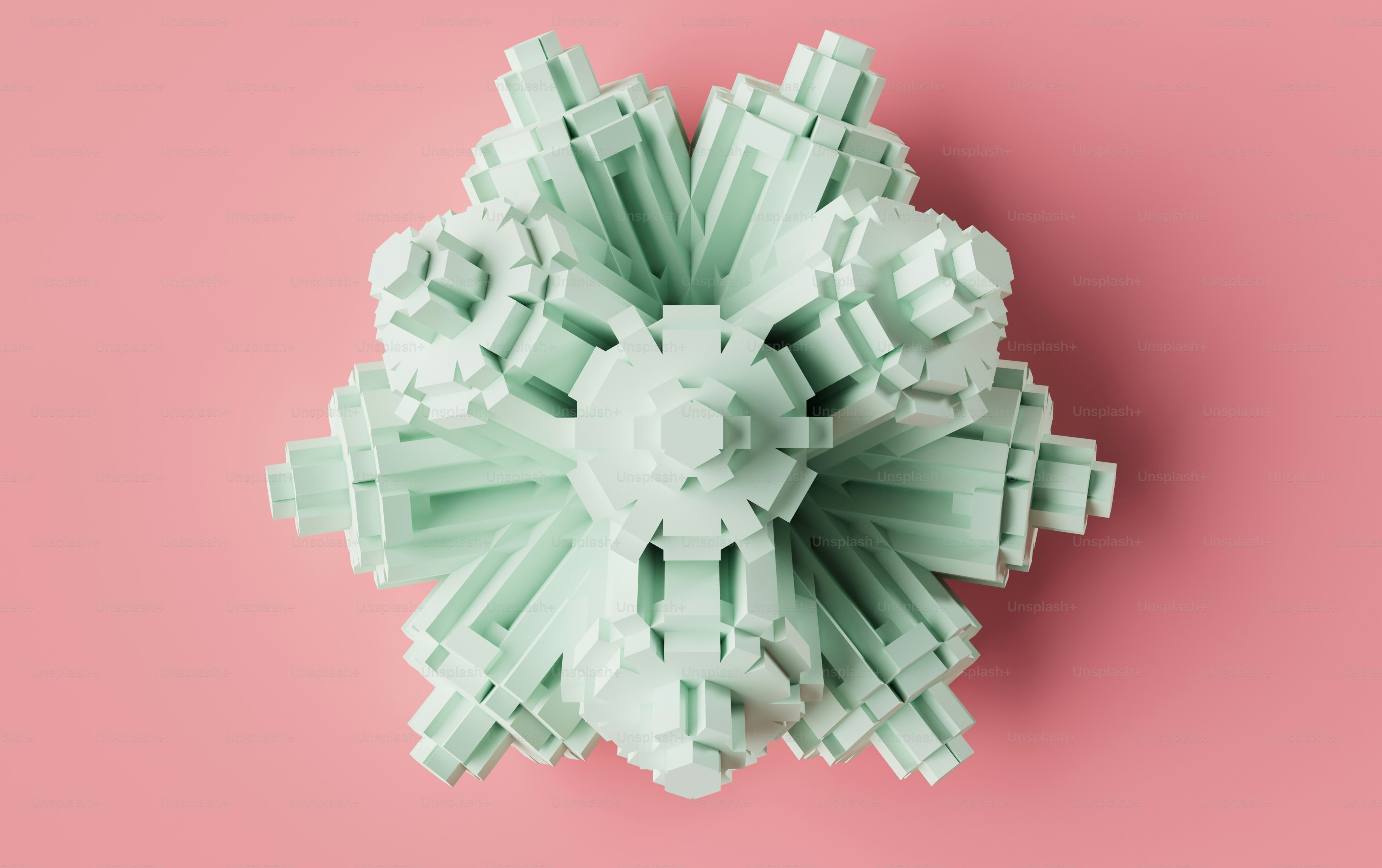 a green object on a pink background
