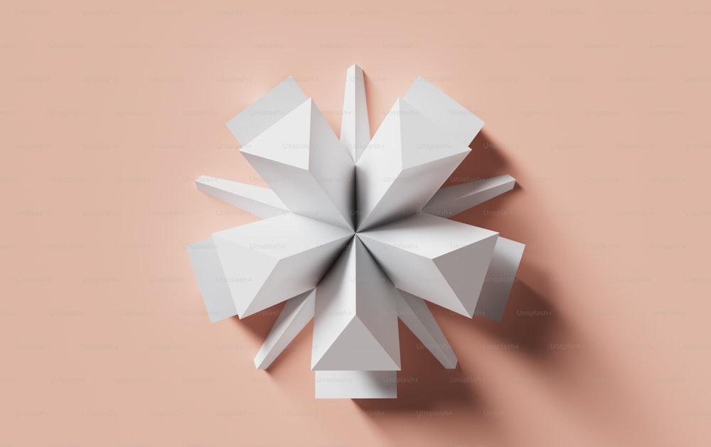 a white origami object on a pink background