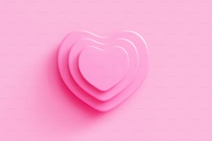 three pink heart shaped plates on a pink background