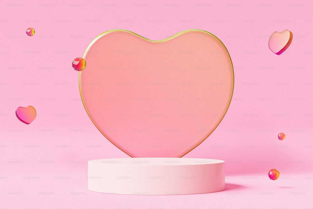 a pink heart shaped object on a pink background