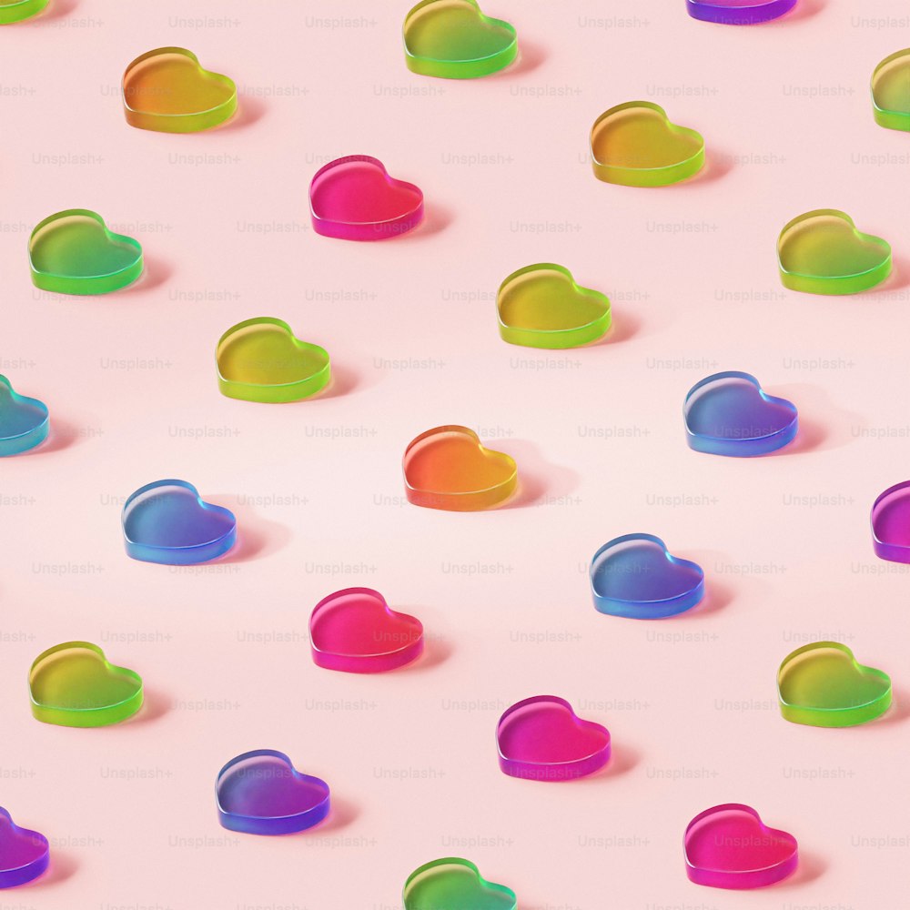 a pink background with many different colored hearts