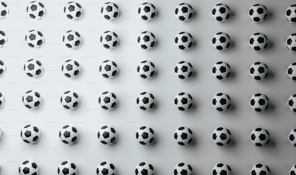 Un gruppo di palloni da calcio in bianco e nero