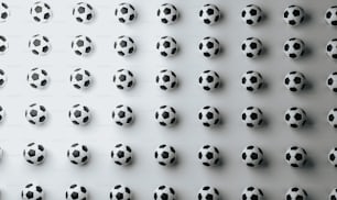 un groupe de ballons de football noirs et blancs
