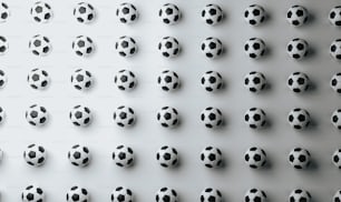 a group of black and white soccer balls