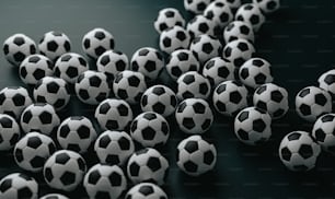 a group of black and white soccer balls