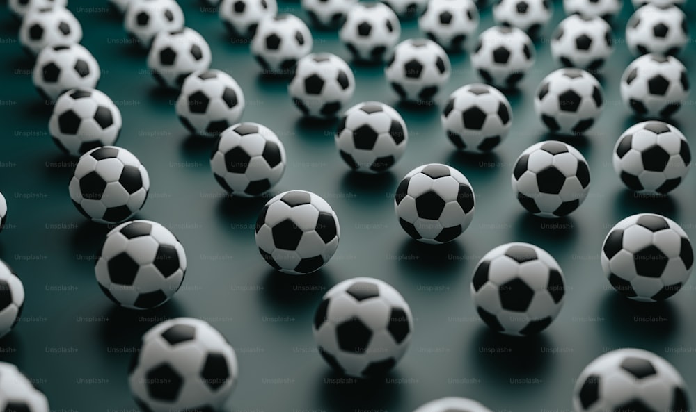 a group of black and white soccer balls