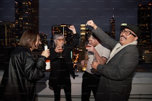 a group of people standing on top of a roof