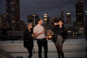 a group of people standing on top of a roof