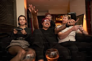 a group of people sitting on top of a couch