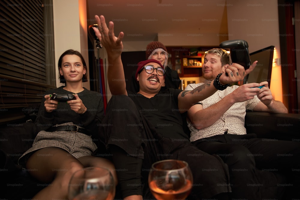 a group of people sitting on top of a couch