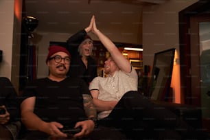 a group of people sitting on top of a couch