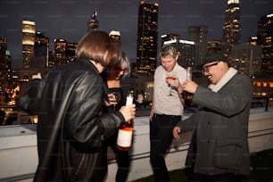 a group of people standing on top of a roof