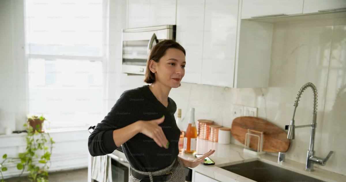 Clean glass of water in a bright kitchen setting, emphasizing everyday healthy water habits.