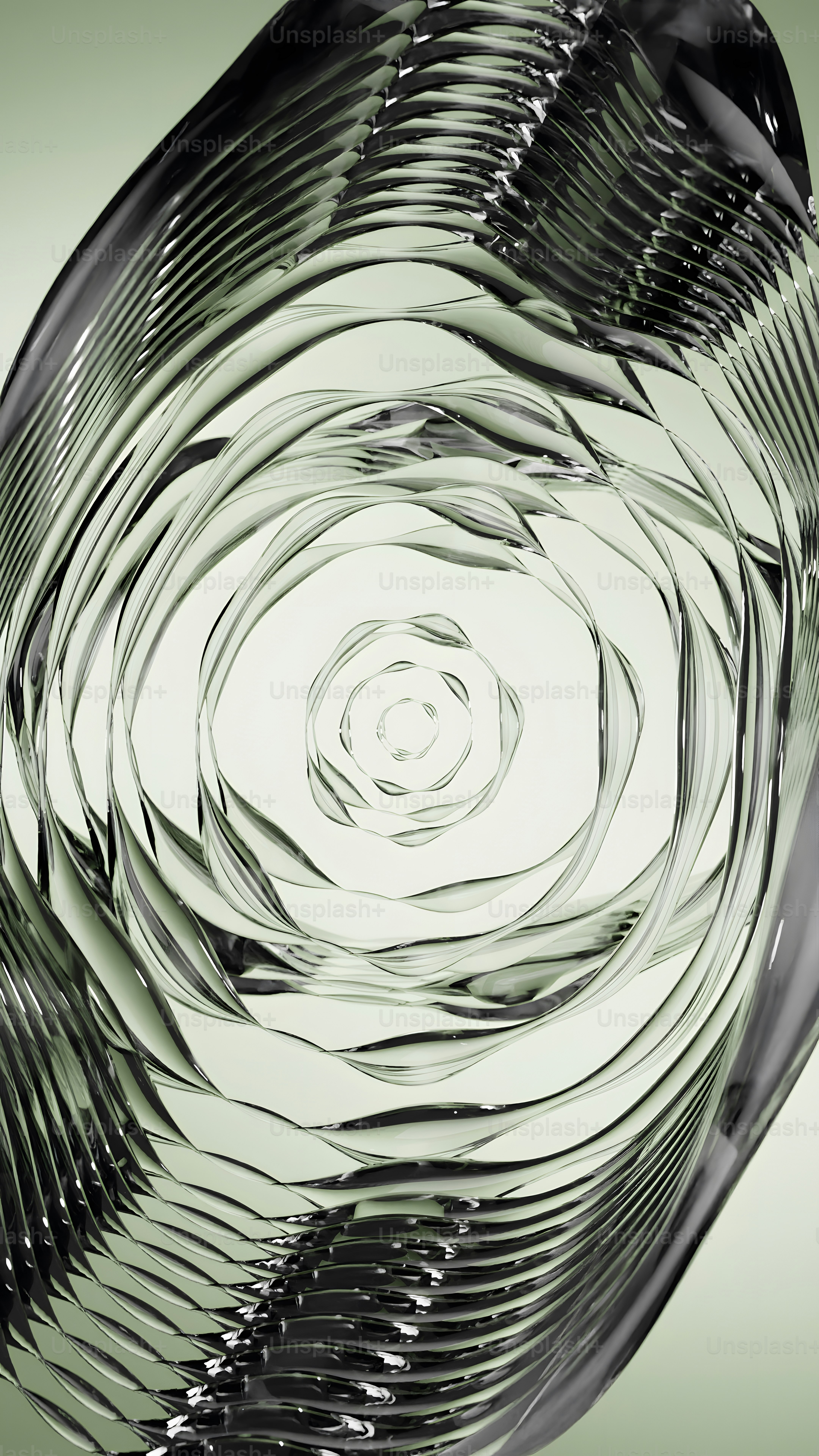 un bol en verre avec un dessin en spirale