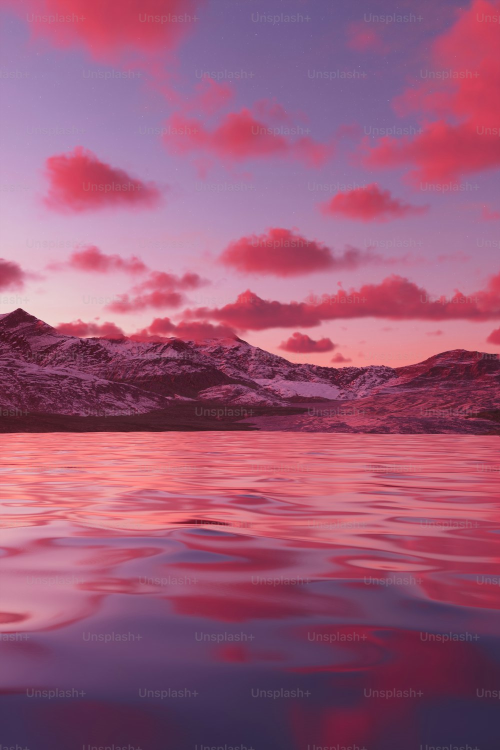 Un tramonto rosa e viola su una catena montuosa