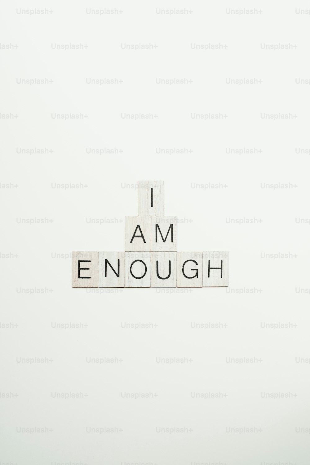 A crossword spelling i am enough on a white background photo
