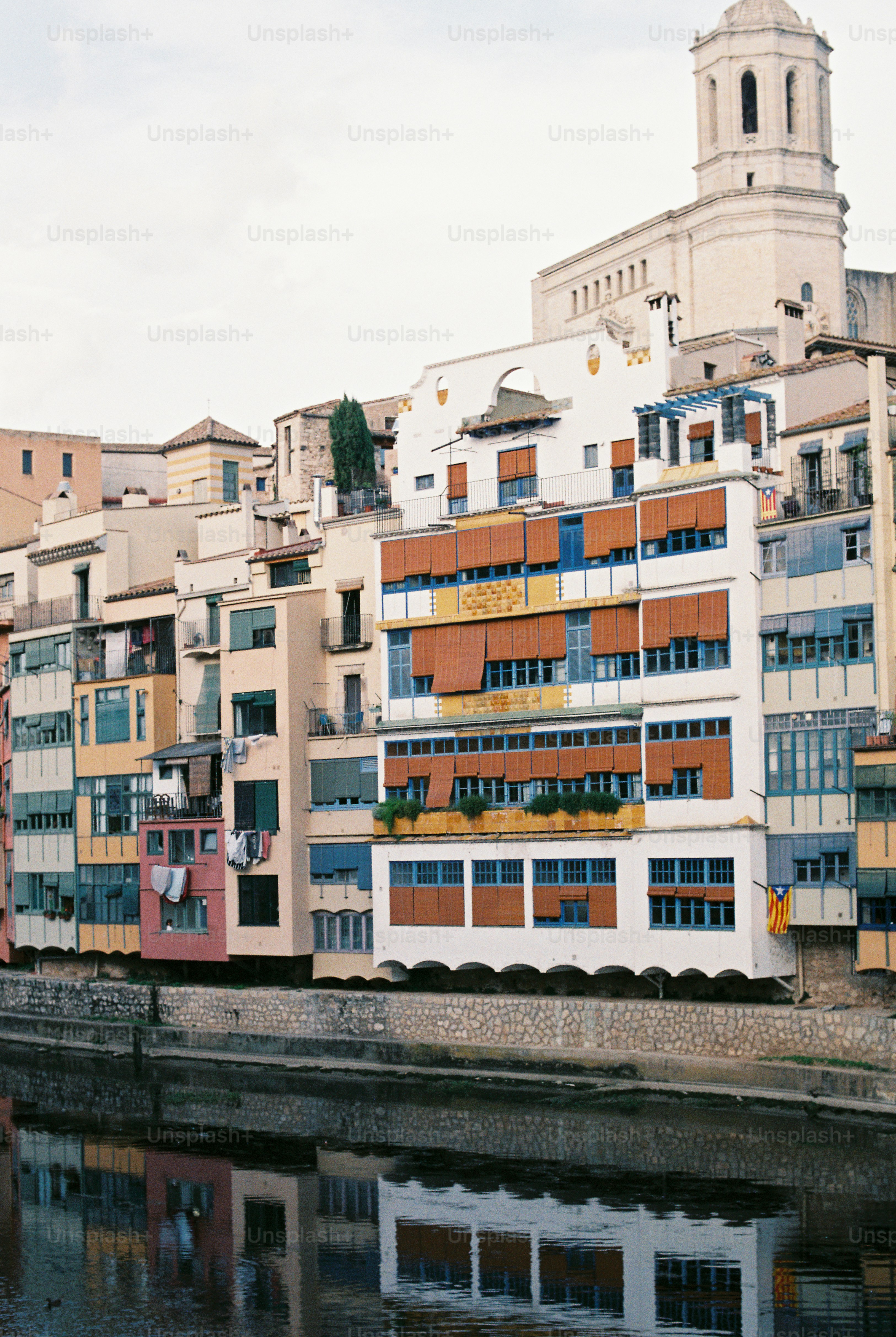 a body of water with buildings in the background