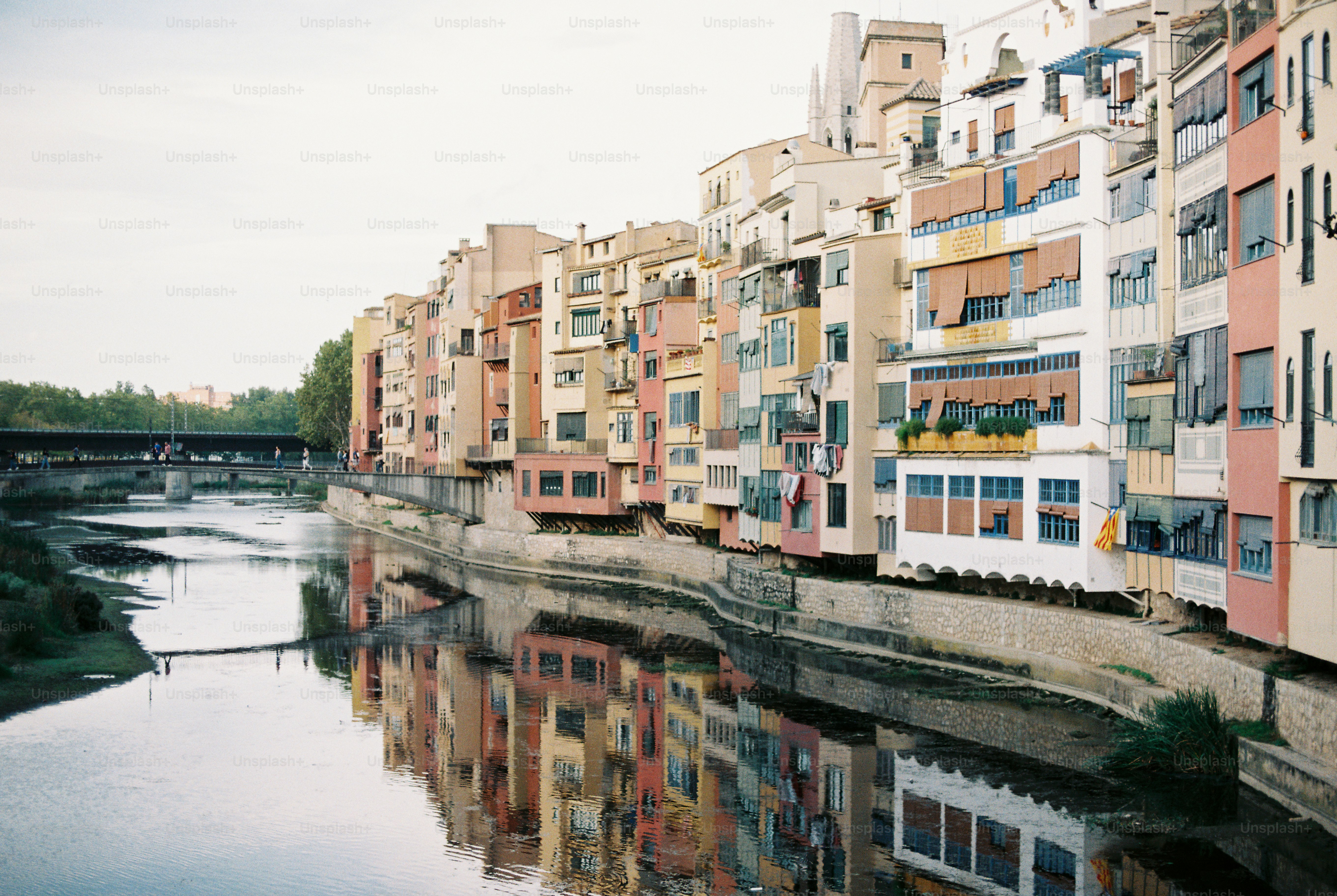 a river running through a city next to tall buildings