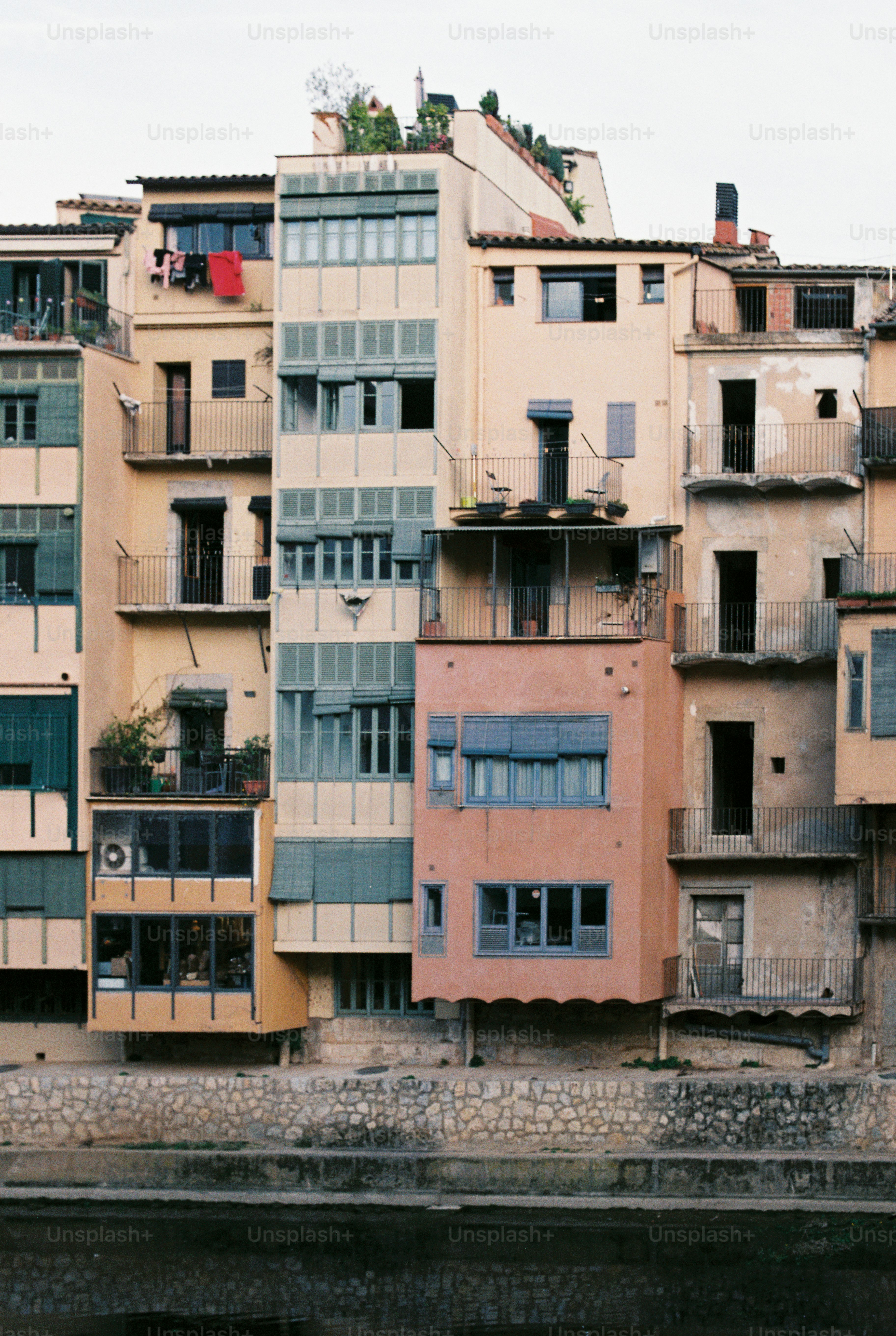 a group of buildings next to a body of water