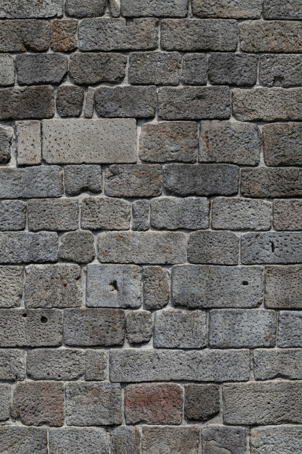 a close up of a brick wall made of stones