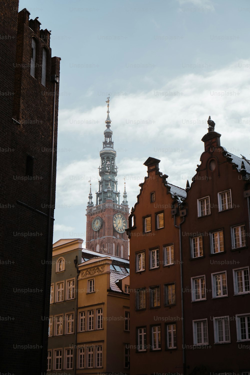 a tall clock tower towering over a city