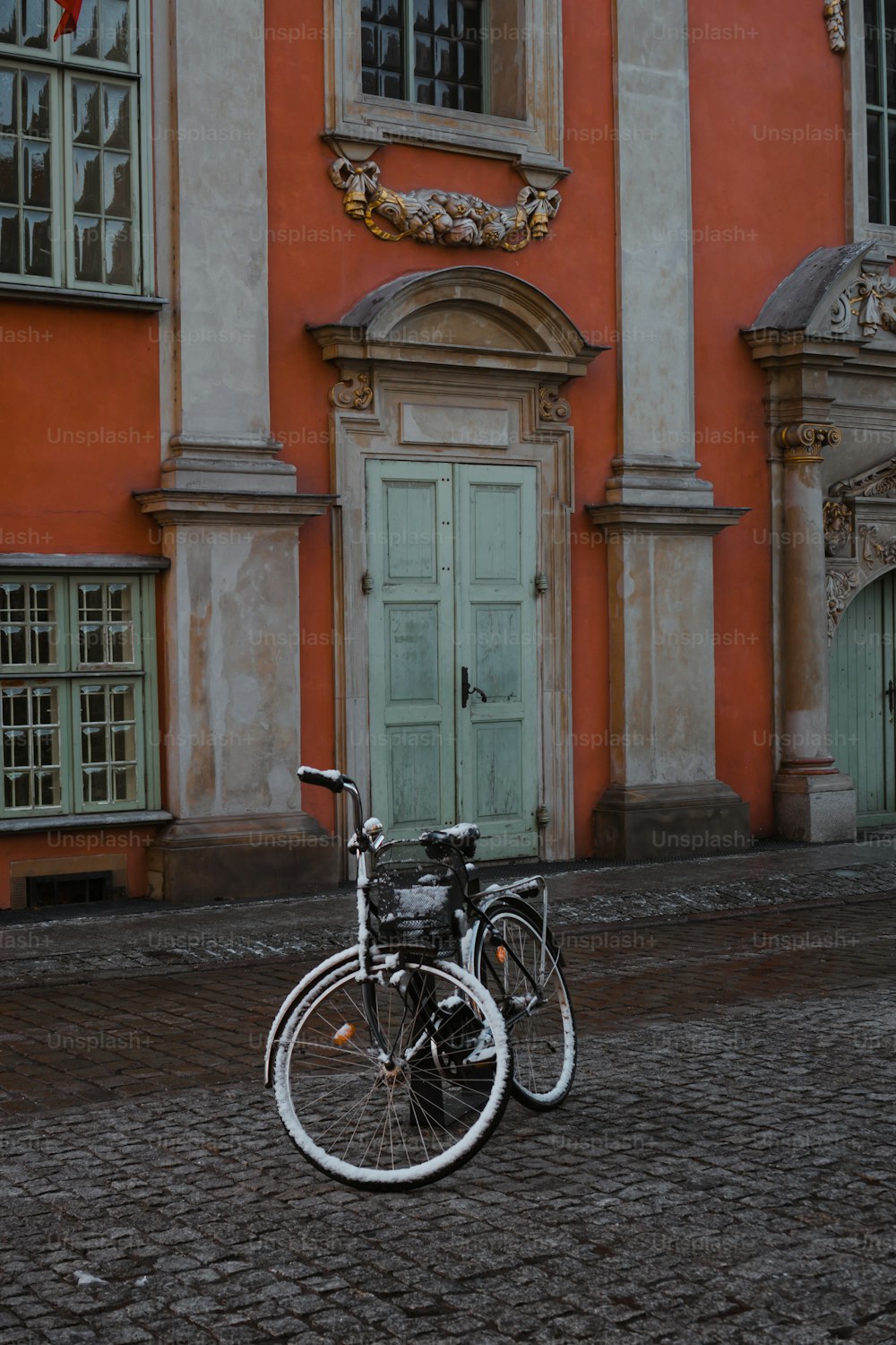 a bicycle parked in front of a building
