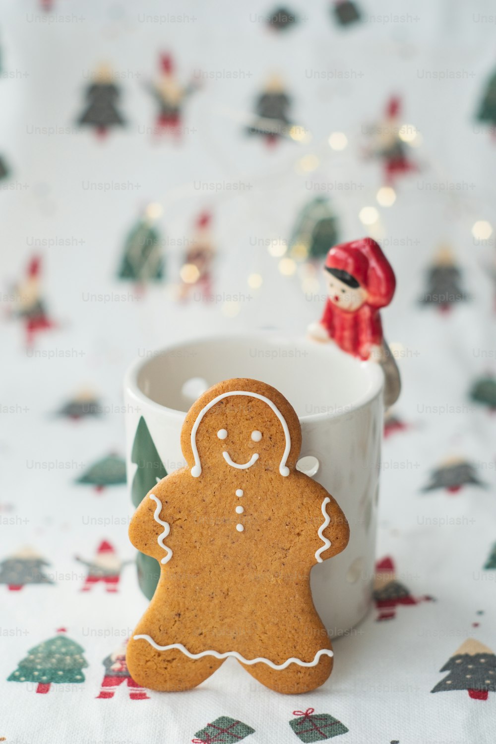 a cup of coffee with a ginger cookie in it
