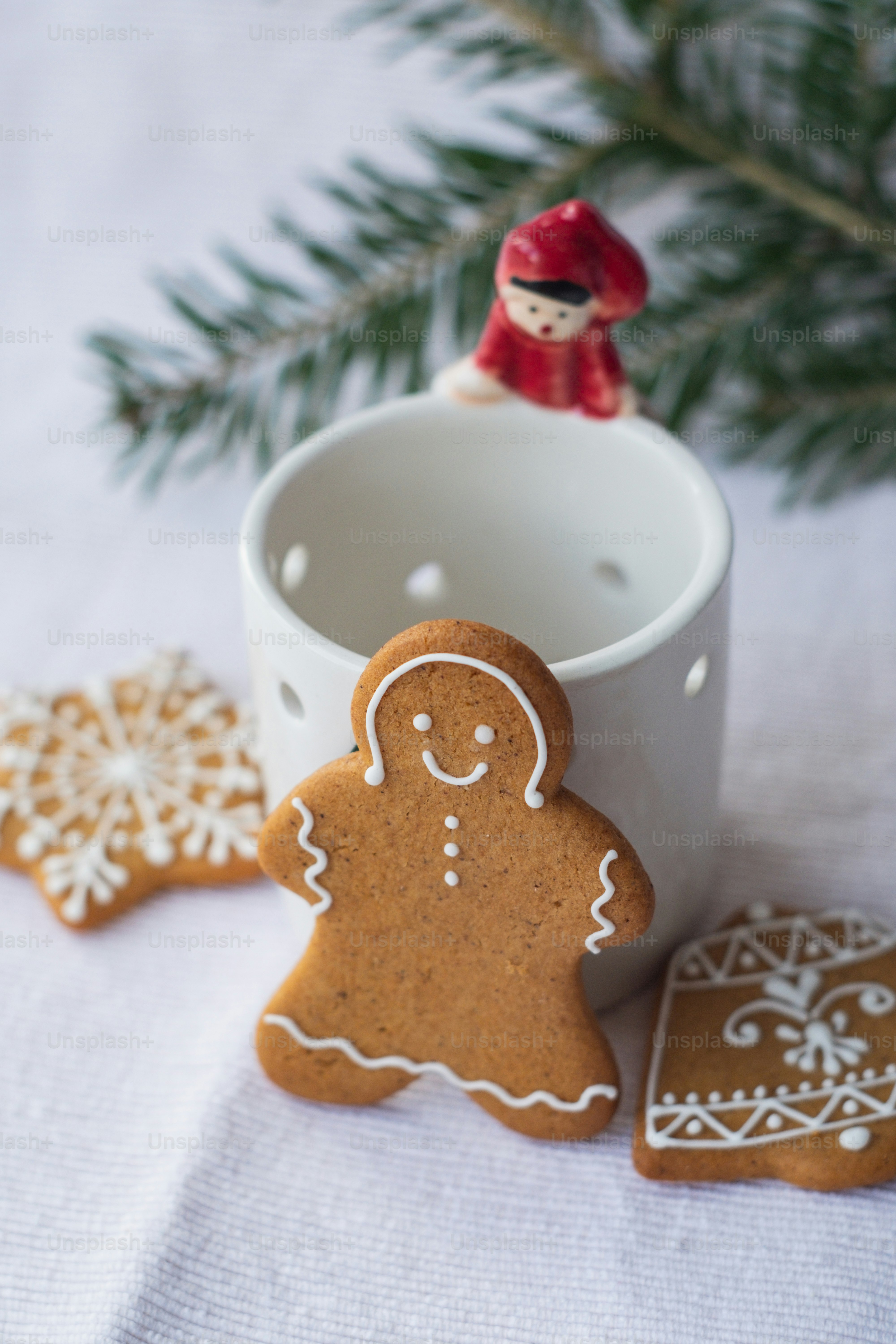 a cup of coffee and some cookies on a table