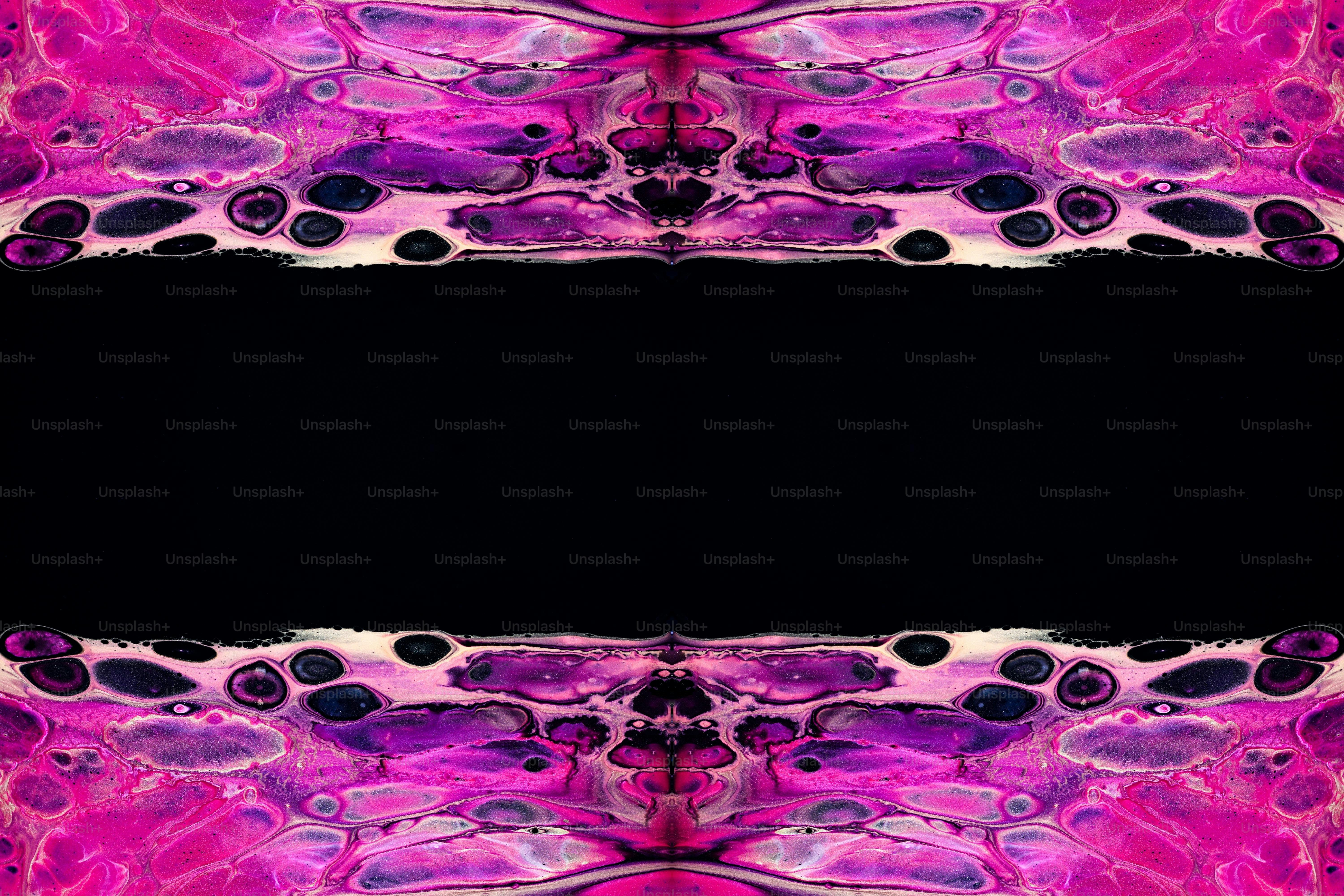 a black background with a pink and purple pattern