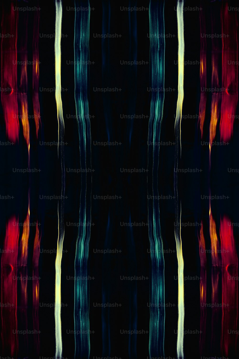 a black background with red, yellow, and blue lines