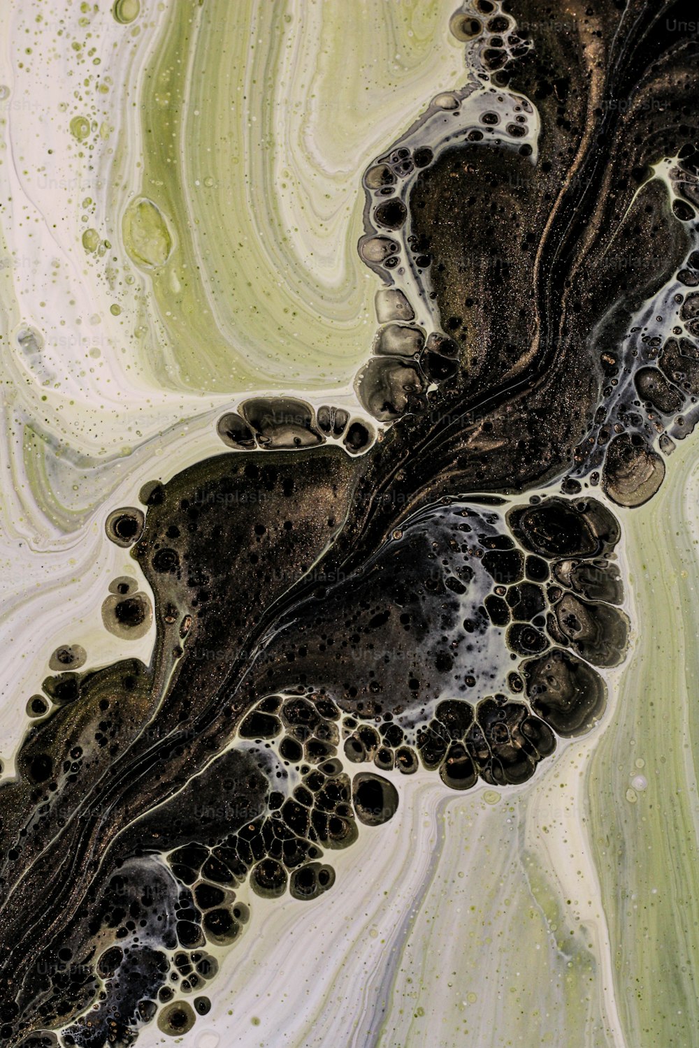 an aerial view of a black and white substance