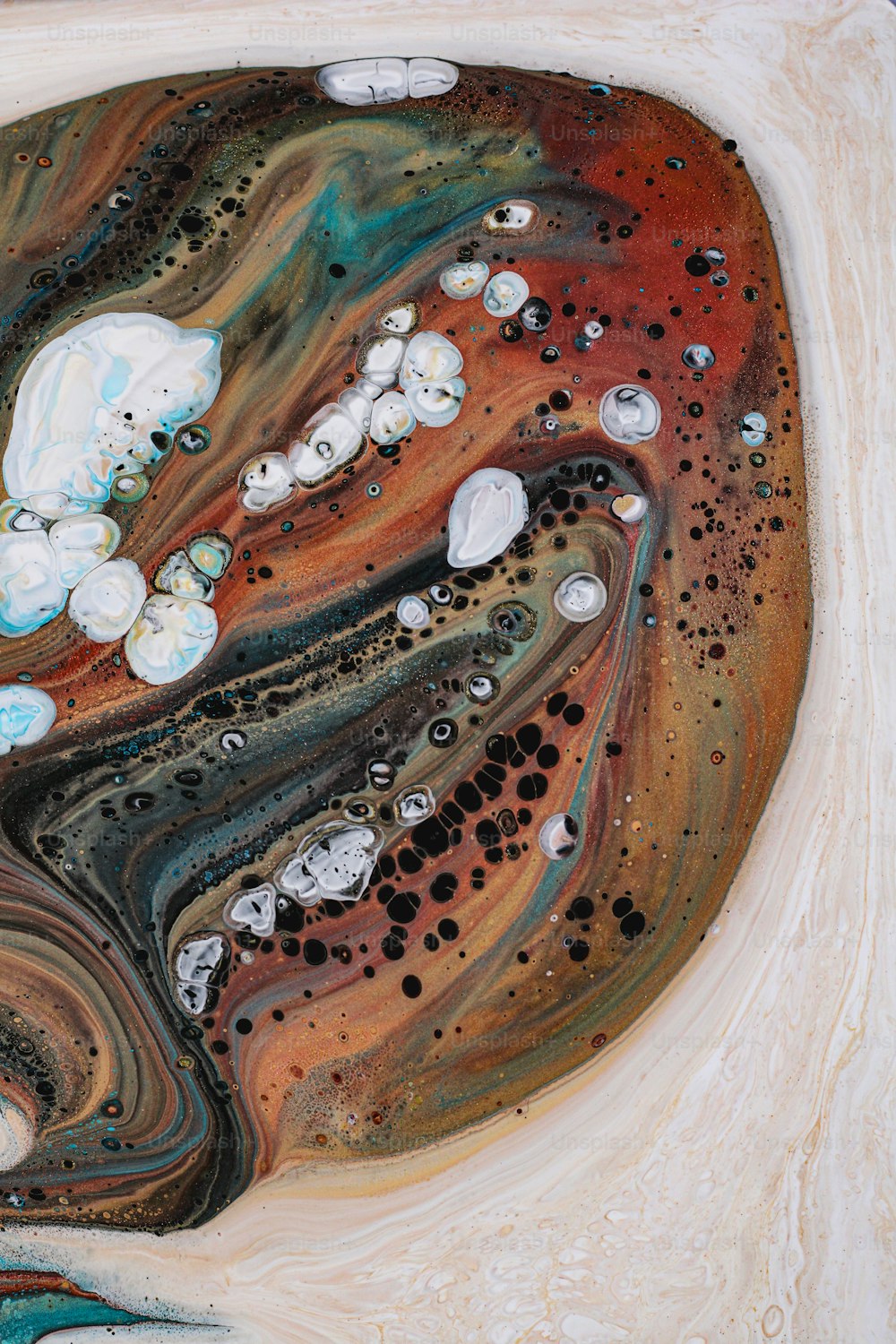 an abstract painting of water, rocks, and bubbles